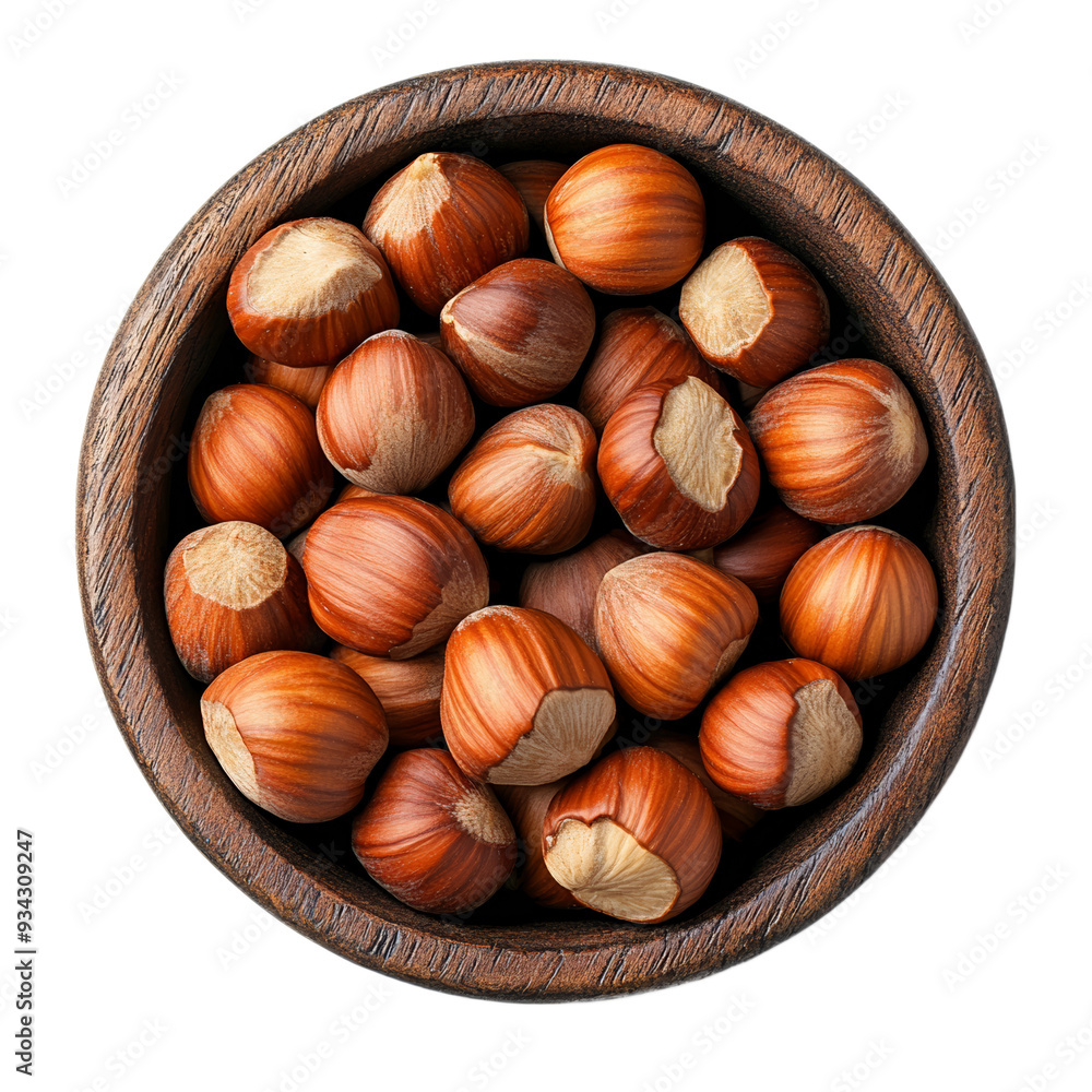 Dark wooden bowl filled with hazelnuts from above isolated on transparent background Dark wooden bowl filled with hazelnuts from above isolated on transparent background