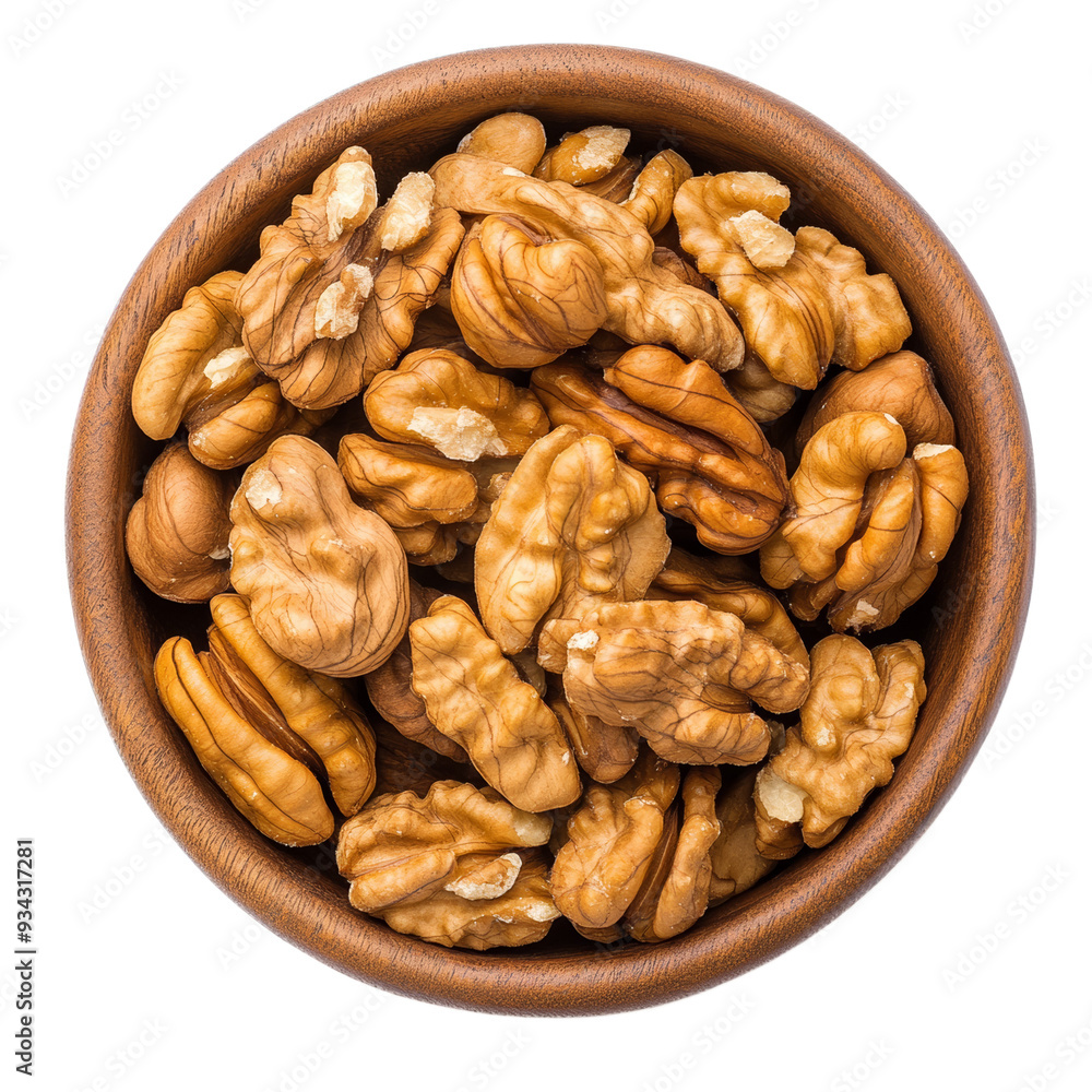 Walnut halves packed in a round wooden bowl top view isolated on transparent background Walnut halves packed in a round wooden bowl top view isolated on transparent background