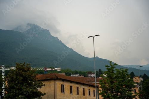 Mandello del Lario, Italy - June 08, 2024: Italian mountains in fog. photo