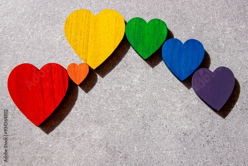 Rainbow hearts on the black background. The sing of Lgbt flag. photo