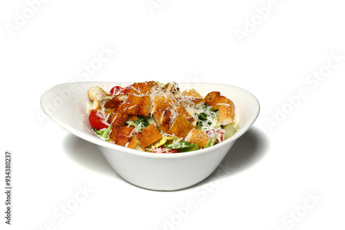 Healthy mixed salad in white bowl on wooden table. Mediterranean salad