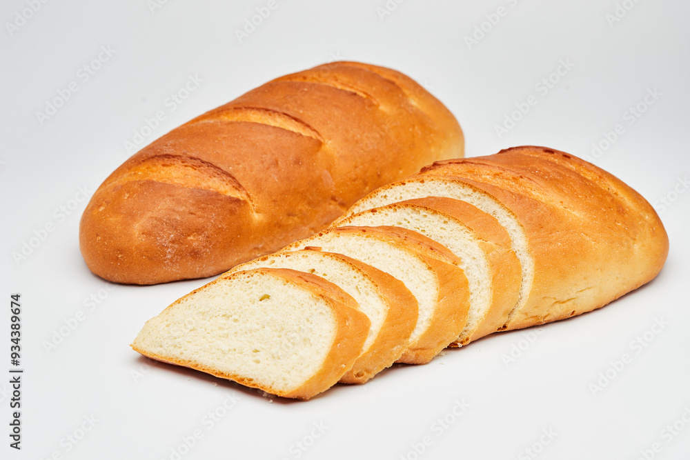 Golden, freshly sliced loaf of homemade bread, perfect for sandwiches, breakfast, or toasting Golden, freshly sliced loaf of homemade bread, perfect for sandwiches, breakfast, or toasting