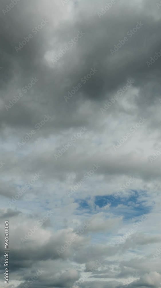 Professional vertical time lapse of flying grey clouds, no flicker, no birds. Professional vertical time lapse of flying grey clouds, no flicker, no birds.