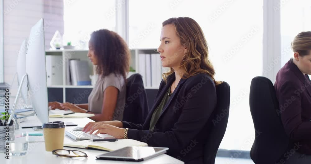 Face, business or happy woman typing on computer in office, working research or startup project online. Social media, portrait or female professional writing email, editing or report in workplace Face, business or happy woman typing on computer in office, working research or startup project online. Social media, portrait or female professional writing email, editing or report in workplace