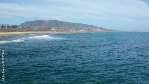 Flyover group of surfers between waves at Trestles beach in San Clemente