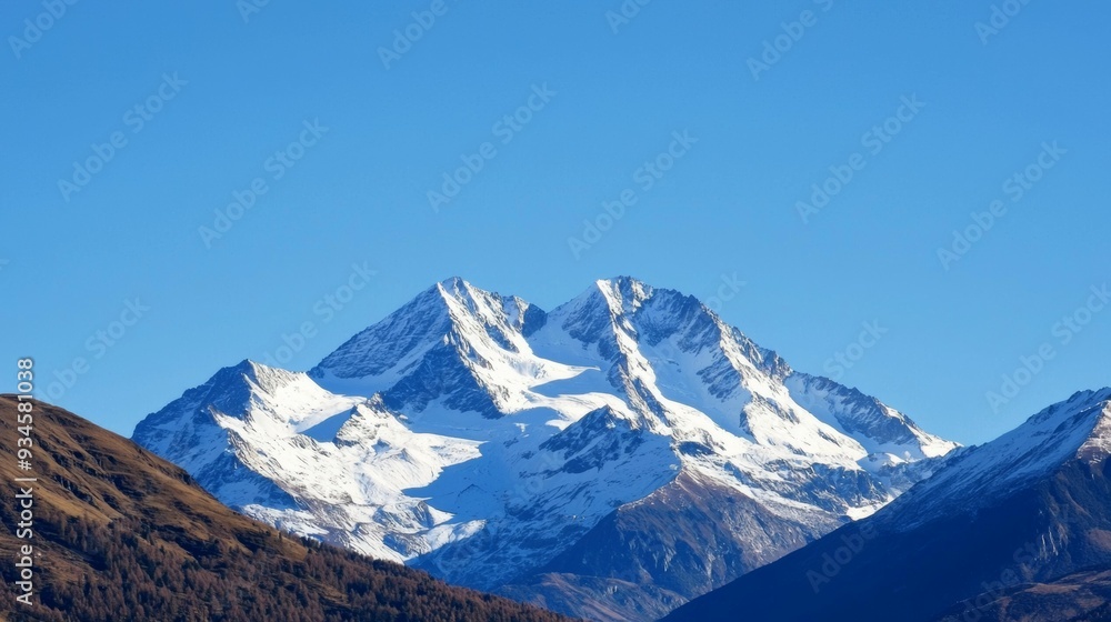 Majestic mountain range with snow-capped peaks and clear blue sky above. Majestic Mountain Range Majestic mountain range with snow-capped peaks and clear blue sky above. Majestic Mountain Range