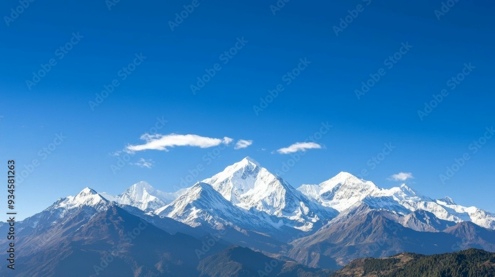 Majestic mountain range with snow-capped peaks and clear blue sky above. Majestic Mountain Range Majestic mountain range with snow-capped peaks and clear blue sky above. Majestic Mountain Range