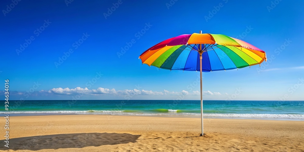Vibrant beach umbrella providing shade on a sunny day at the seaside Vibrant beach umbrella providing shade on a sunny day at the seaside