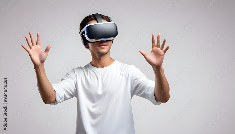 Young man using VR virtual reality headset in studio portrait white background Young man using VR virtual reality headset in studio portrait white background