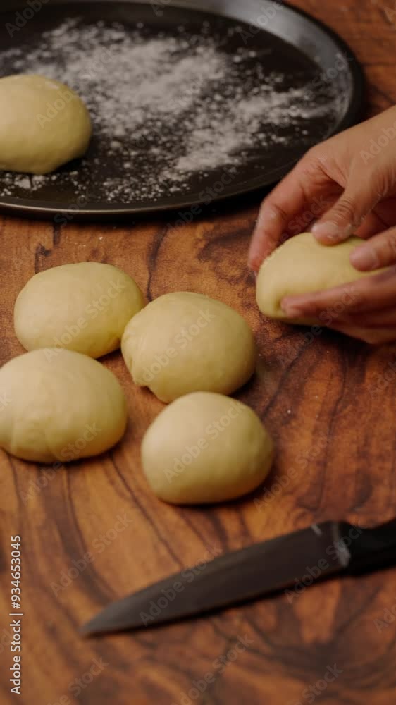 vertical bakery video, rolling yeast dough to make homemade bread vertical bakery video, rolling yeast dough to make homemade bread