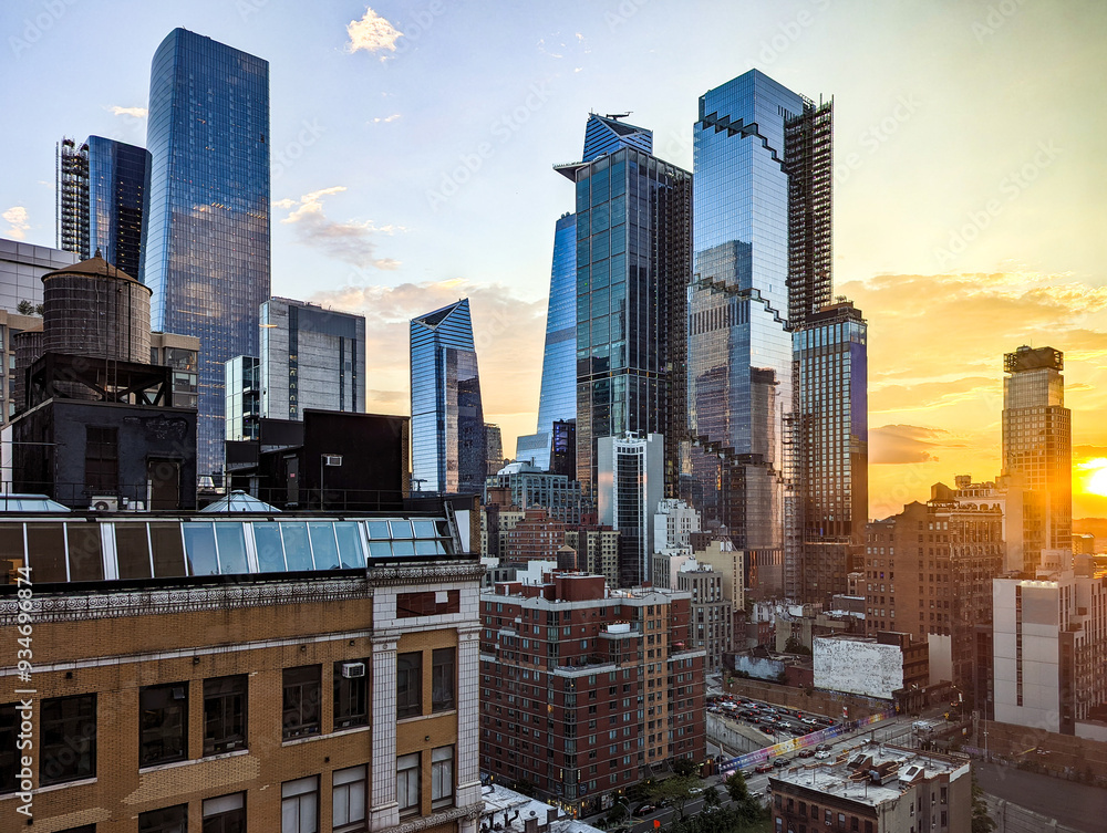 New York City - glass skyscrapers in Hudson Yards with sunlight shining in the skyline background
