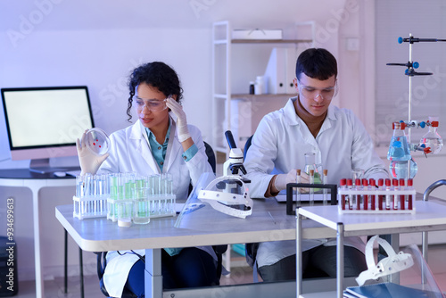 Chemists working at table i...