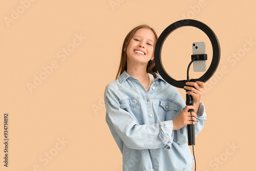 Teenage blogger with mobile...