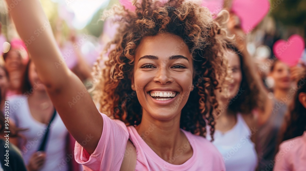 Group of happy young women in pink wear smiling and looking at camera. Breast cancer awareness concept. Group of happy young women in pink wear smiling and looking at camera. Breast cancer awareness concept.