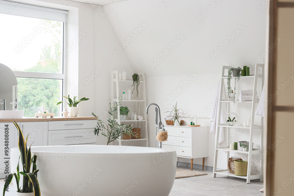 Interior of light bathroom with counters, shelf units and bathtub Interior of light bathroom with counters, shelf units and bathtub