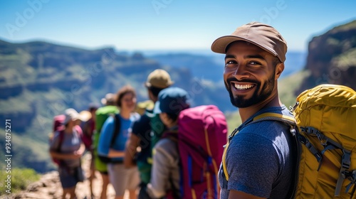 Obraz na płótnie A joyful man with friends in colorful backpacks enjoys a sunny hike with stunning views. w salonie