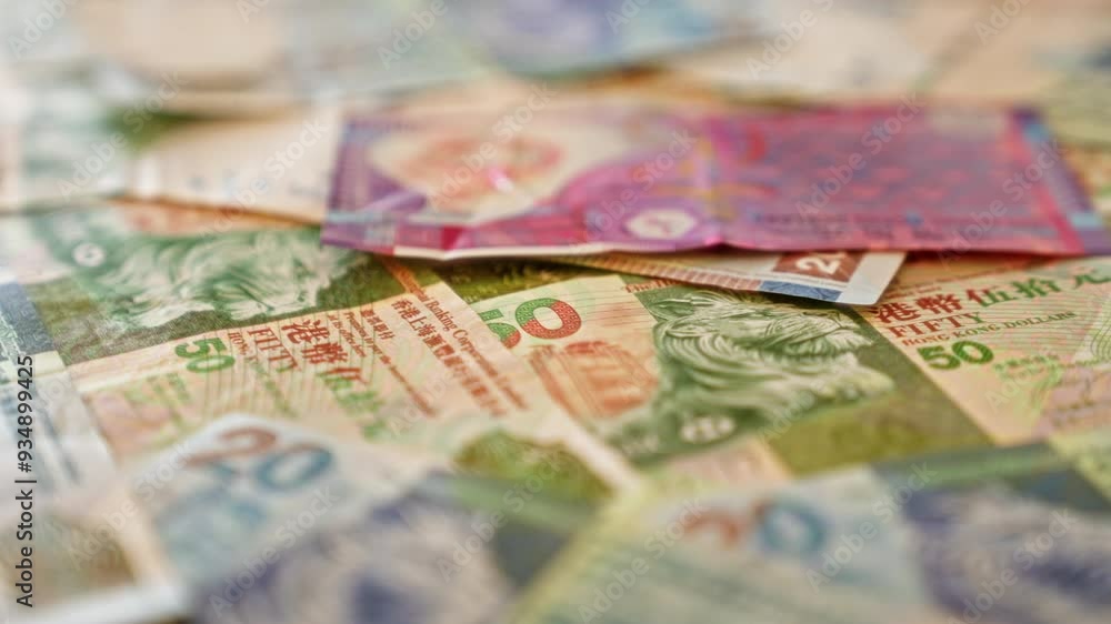 Closeup of colorful hong kong dollar banknotes spread out, showcasing various denominations and intricate designs in a vibrant, detailed pattern Closeup of colorful hong kong dollar banknotes spread out, showcasing various denominations and intricate designs in a vibrant, detailed pattern