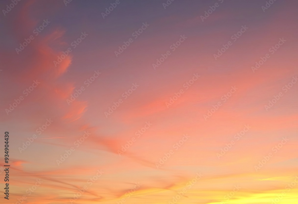 Obraz premium Colorful gradient sky with soft, wispy clouds at sunset or sunrise
