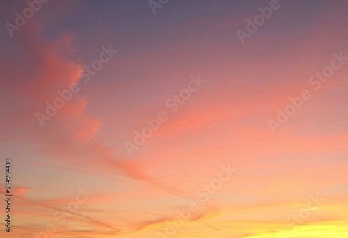 Colorful gradient sky with soft, wispy clouds at sunset or sunrise