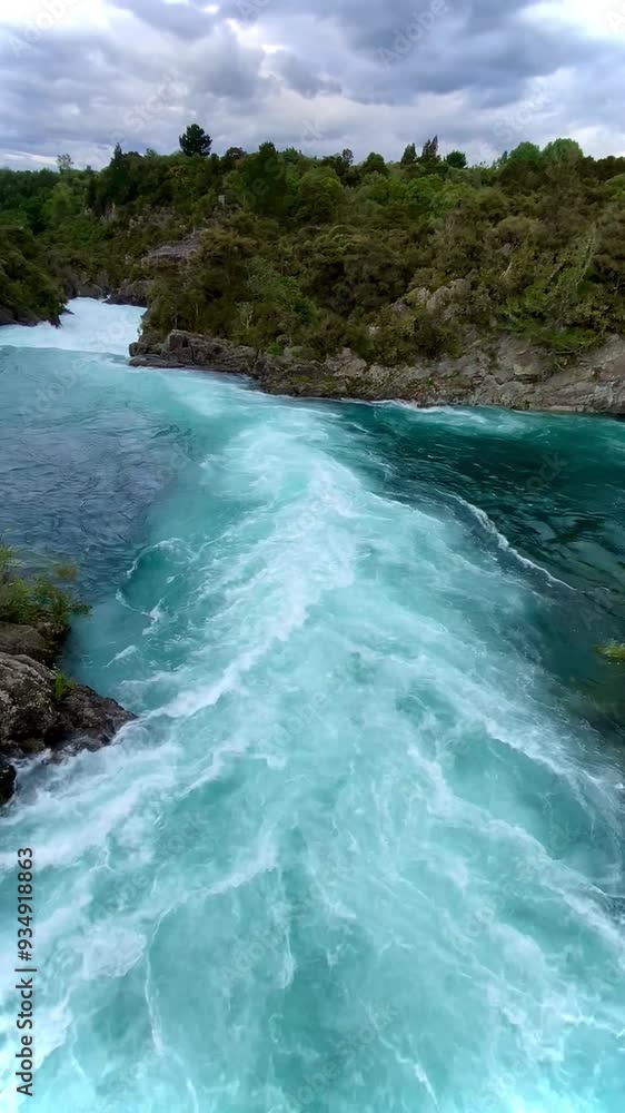 Aratiatia rapids, scenic site with a dam and roaring waters on the Waikato river, Taupo, New Zealand. Water flowing over the rocks Aratiatia rapids, scenic site with a dam and roaring waters on the Waikato river, Taupo, New Zealand. Water flowing over the rocks
