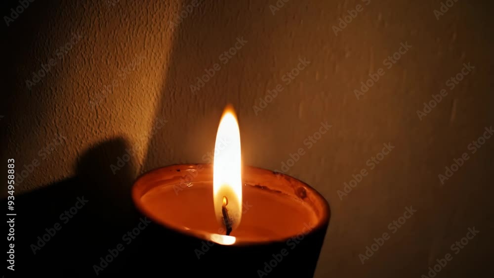 A candle flickers softly in the darkness, casting a warm glow that illuminates its surroundings, creating a serene atmosphere filled with hope and tranquility. A candle flickers softly in the darkness, casting a warm glow that illuminates its surroundings, creating a serene atmosphere filled with hope and tranquility.