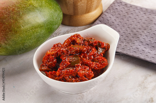 Spicy pickled raw green mango photo