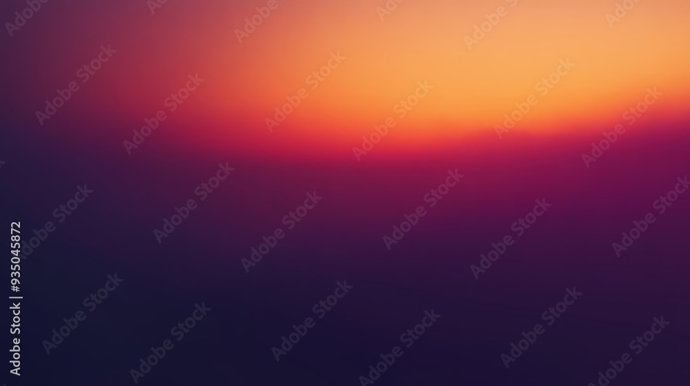 Obraz premium A vibrant sunset blending hues of orange, purple, and blue, creating a peaceful and tranquil atmosphere in nature.