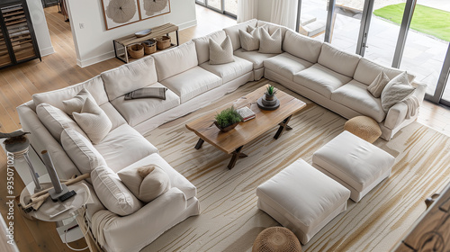 an open-plan living room interior design, use a large sectional sofa to define the seating area. a neutral color like beige or light gray with a mix of textures in cushions, rugs, and throws