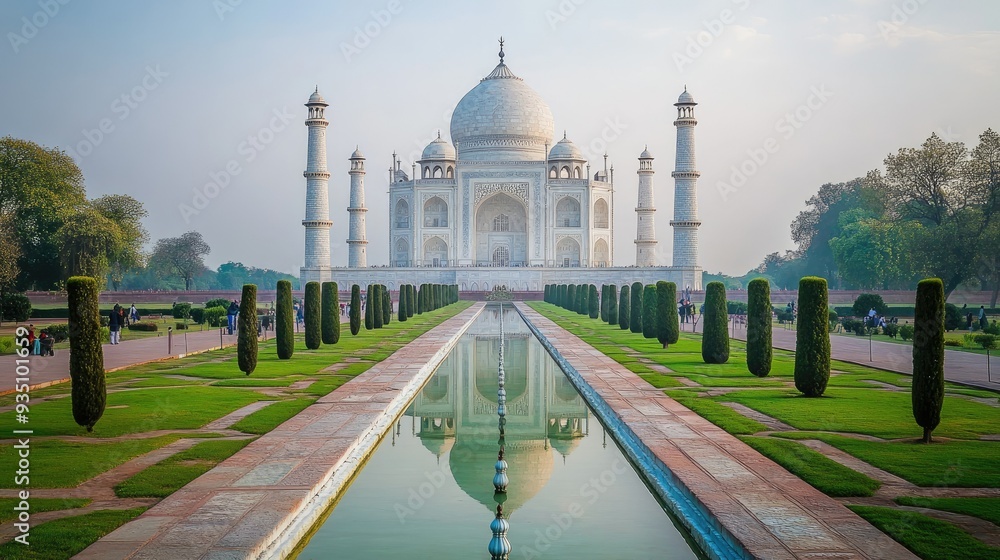 Obraz premium Majestic view of the Taj Mahal from a distance with an empty foreground for text. Iconic symbol of love.