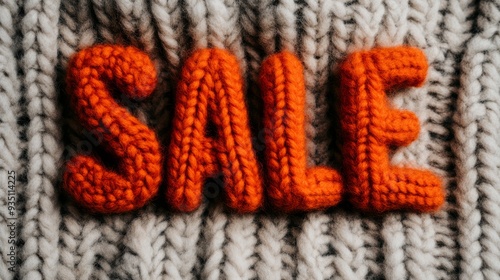 Wallpaper Mural the word "SALE" formed by arranging cozy autumn items like woolen scarves, knitted hats, and mittens in fall colors. The background features a soft blanket   Torontodigital.ca