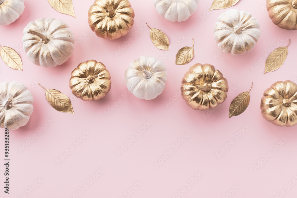 Stylized white and gold decorative pumpkins and golden leaves border on a pale pink background for autumn and Thanksgiving cards. Stylized white and gold decorative pumpkins and golden leaves border on a pale pink background for autumn and Thanksgiving cards.