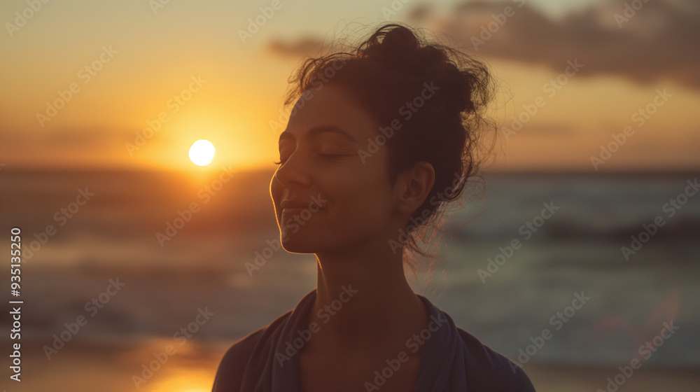 A woman stands peacefully on the beach, smiling softly while the sun sets on the horizon, casting warm colors across the sky and waves A woman stands peacefully on the beach, smiling softly while the sun sets on the horizon, casting warm colors across the sky and waves