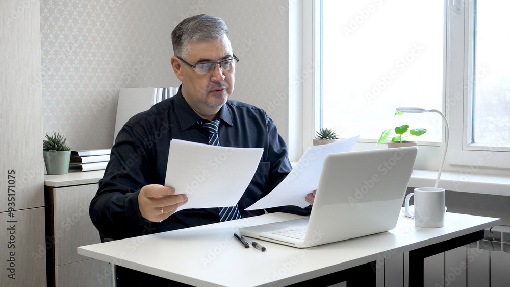 Man Working with Documents at Office Desk Man Working with Documents at Office Desk