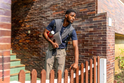 Wallpaper Mural Young african businessman leaving home to go to work Torontodigital.ca