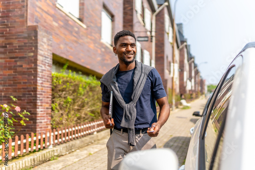 African young businessman going to work by car