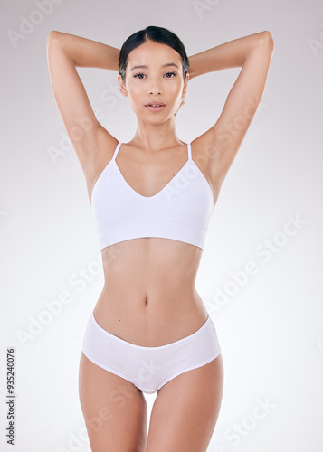 Girl, underwear and portrait in studio with healthy body, transformation and show stomach by white background. Girl, person and model with change, results and lose weight for wellness in Colombia