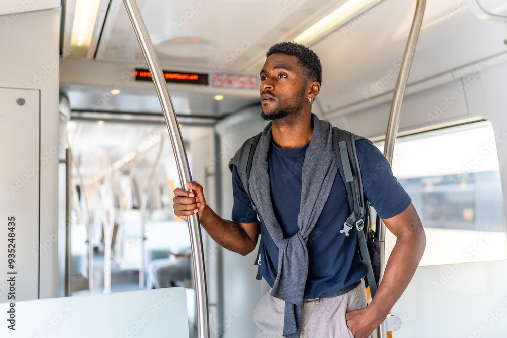 African young man travelling by metro along the city African young man travelling by metro along the city