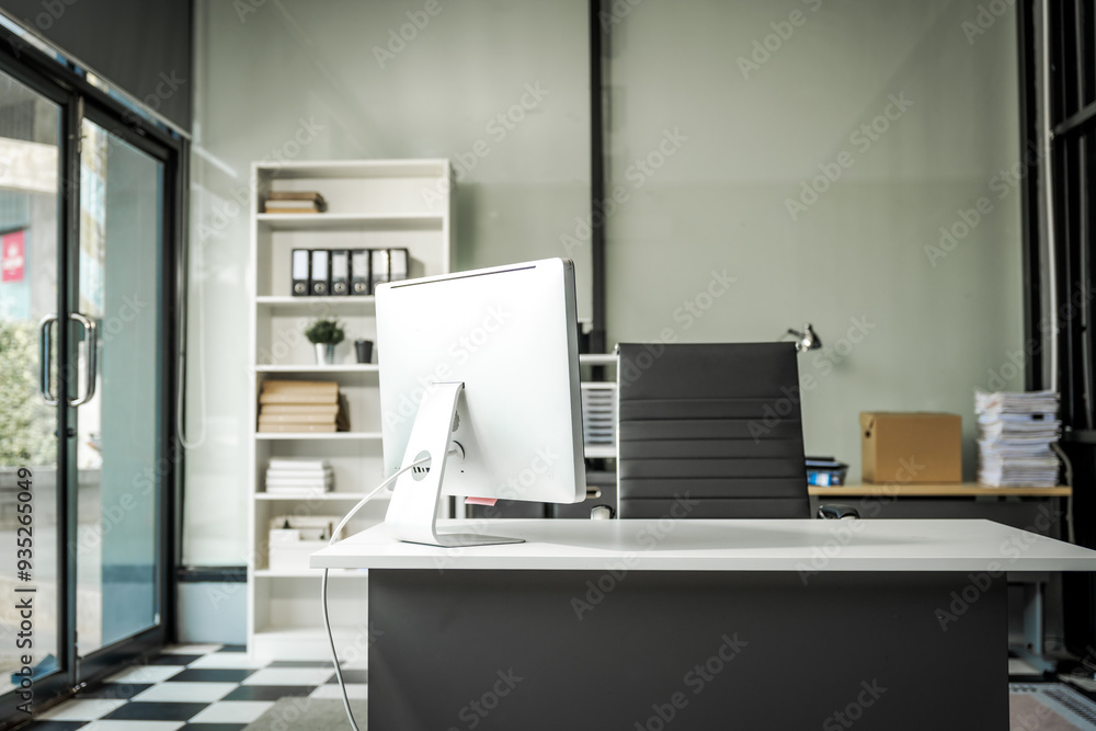 A modern office desk with a laptop, monitor, and plant. sleek, minimal design features open space, technology and productivity. room is empty, offering a clean and organized workspace. A modern office desk with a laptop, monitor, and plant. sleek, minimal design features open space, technology and productivity. room is empty, offering a clean and organized workspace.