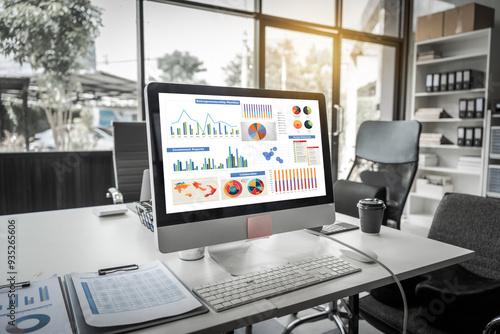 Wallpaper Mural A modern office desk with a laptop, monitor, and plant. sleek, minimal design features open space, technology and productivity. room is empty, offering a clean and organized workspace. Torontodigital.ca