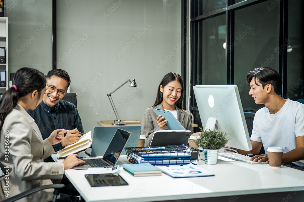 Asian colleagues meet at a desk, discussing business financial terms, investment strategies, managing funds. Their focus is on planning, analysis, and operations to ensure stability and success. Asian colleagues meet at a desk, discussing business financial terms, investment strategies, managing funds. Their focus is on planning, analysis, and operations to ensure stability and success.