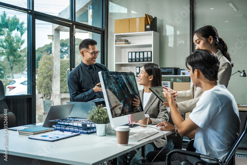 Asian colleagues meet at a desk, discussing business financial terms, investment strategies, managing funds. Their focus is on planning, analysis, and operations to ensure stability and success.