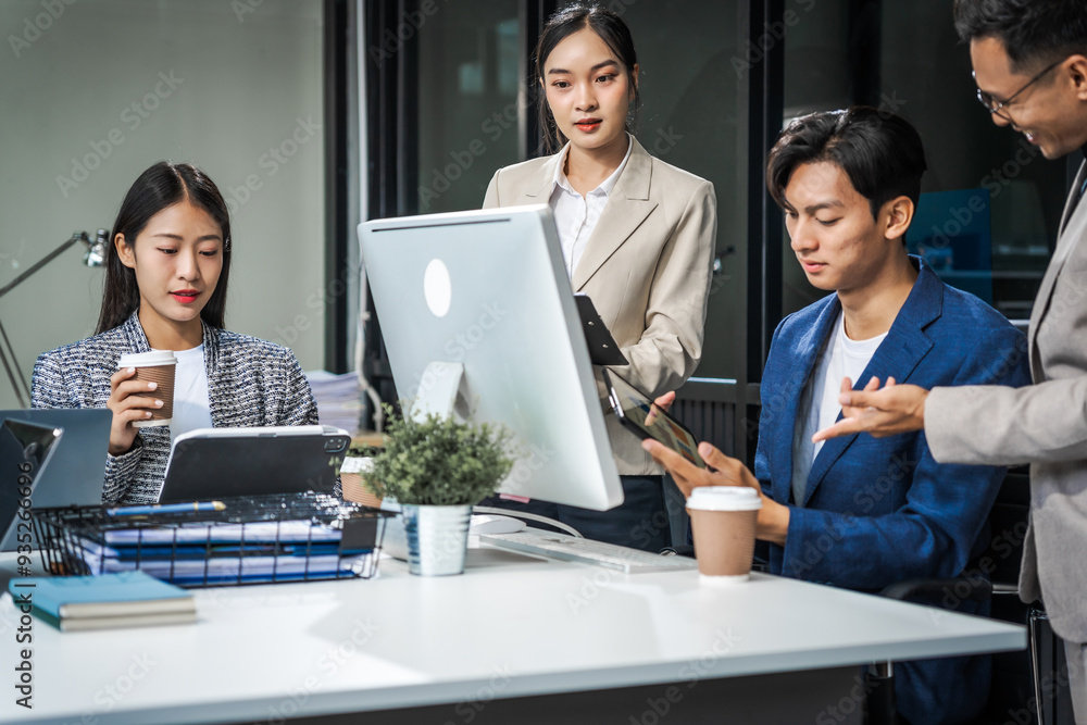 Asian colleagues meet at a desk, discussing business financial terms, investment strategies, managing funds. Their focus is on planning, analysis, and operations to ensure stability and success. Asian colleagues meet at a desk, discussing business financial terms, investment strategies, managing funds. Their focus is on planning, analysis, and operations to ensure stability and success.