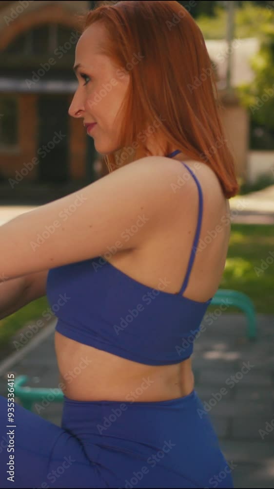 Portrait Shot of a Beautiful Confident Middle Age Fitness Woman in Violet Athletic Sportswear Warm Up and Stretch Before Training Exercise Portrait Shot of a Beautiful Confident Middle Age Fitness Woman in Violet Athletic Sportswear Warm Up and Stretch Before Training Exercise