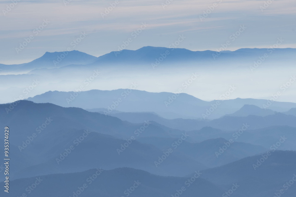 Obraz premium Shadows of mountains at blue hour