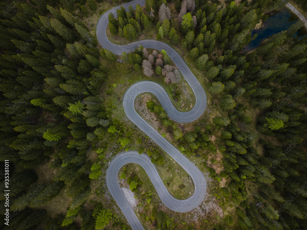 Snake road from a drone view in the Italian Alps, The Dolomites, Italy Snake road from a drone view in the Italian Alps, The Dolomites, Italy