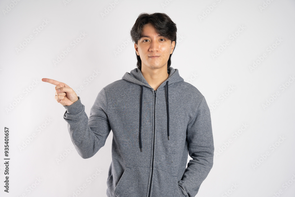 Portrait of asian man wearing hoodie posing on white background Portrait of asian man wearing hoodie posing on white background