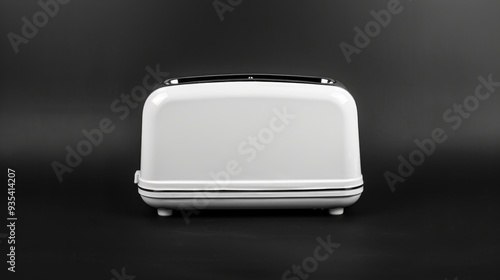 A modern toaster with slices of bread inside, set against a white background 