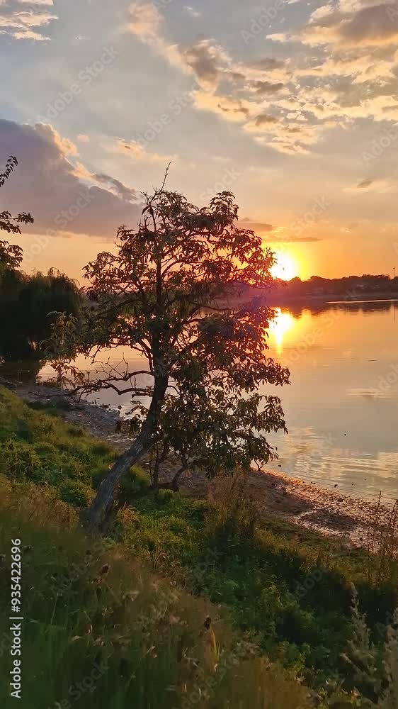 Beautiful sunset at the lake. Warm summer season evening Beautiful sunset at the lake. Warm summer season evening