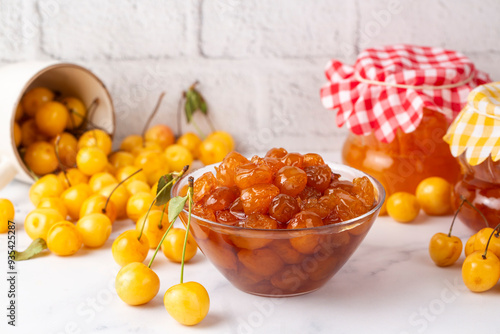 Homemade DIY natural canned yellow cherry plum sauce chutney with chilli or tkemali in glass jar