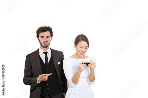 Closeup portrait sneaky upset jealous possessive boyfriend angry watching girlfriend happily texting someone else isolated white background.  photo